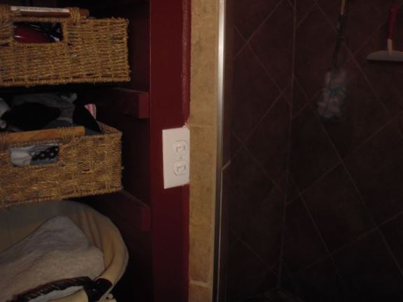 This light switch is too close to the shower. 