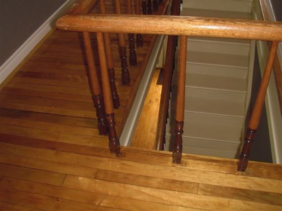 This photo shows that the stair spindle spaces that are too wide for toddlers � a very dangerous situation.